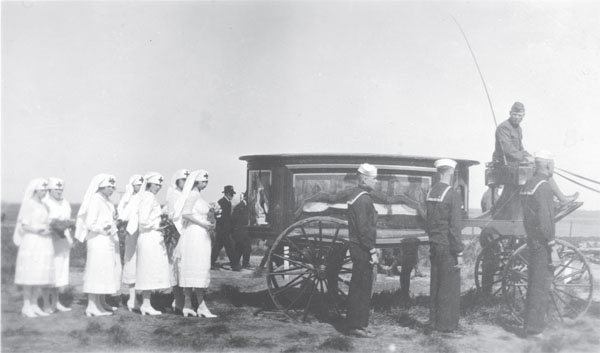 Hearse and part of the funeral procession for G.P. Cather in Bladen, Nebraska, 3 May 1921.