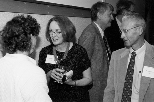 Image of Seminar director, Susan J. Rosowski visits with Tom Lyon, seminar leynoter, and Janis Lyon.