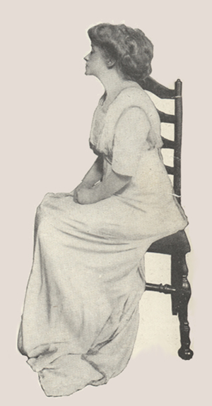 Profile of Mrs. Fiske sitting in a chair, head raised and eyes closed.