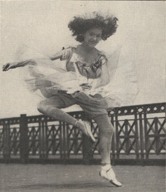 Female ballet dancer in mid-air.