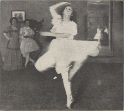 Female dancer spinning on one toe with toe of other leg pointed toward the calf of the leg she is spinning on.