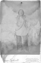 Native American man holding pistol