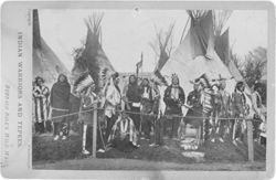 Native Americans in front of tipis