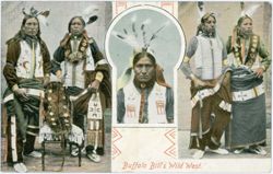 Native American men posing in traditional regalia