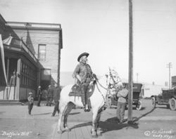 William F. Cody on horse in front of Irma Hotel