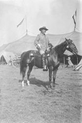 William F. Cody on horseback on backlot of Buffalo Bill's Wild West