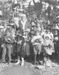 William F. Cody as Santa Claus standing with group of children near Oracle, Arizona