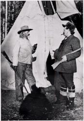 William F. Cody and David Franklin Powell in front of tipi