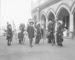 William F. Cody and five Native American men standing beside Cliff House