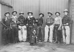 Tom Isbell, seven cowboys, and lady dwarf from Buffalo Bill's Wild West