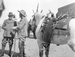 William F. Cody and Prince of Monaco next to white horse in Cody, Wyoming