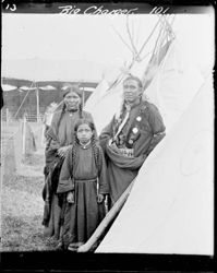 Big Charger standing with woman and child